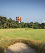 Golf course with windmills at Thorpeness golf club in Suffolk