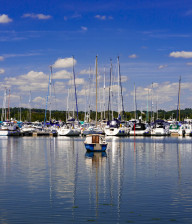 Sailing boats in calm waters at Poole Quay, Dorset