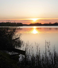 Sunset reflected on water, whisby nature park, Lincolnshire