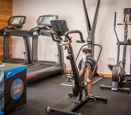 Gym with treadmills, cross trainer and spin bike at Juliots Well Holiday Park, Cornwall