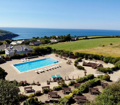 Aerial view of picnic area and outdoor pool at Seaview Gorran Haven in Cornwall