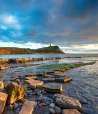 Dramatic clouds in the sky over Kimmeridge Bay in Dorset