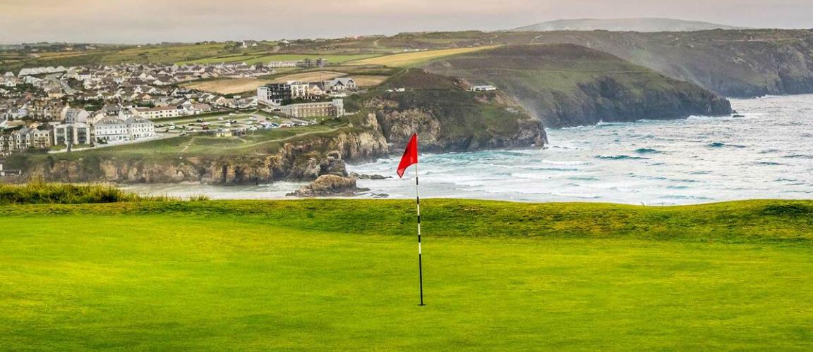 Flag in hole on Perranporth golf course in Cornwall